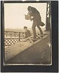 [Alfred Stieglitz Photographing on a Bridge]