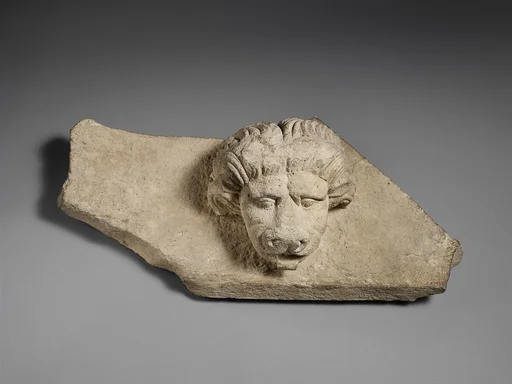 Limestone cornice with a lion’s head