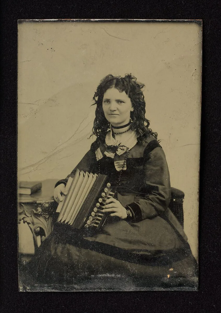 Woman Holding an Accordion tintype — Unknown