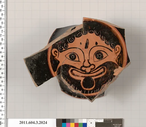 Terracotta fragment of a stemless kylix (drinking cup)
