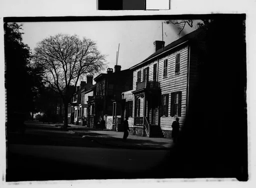 [Row of Italianate Houses of Street with Men on Corner, From Automobile, Savannah, Georgia]