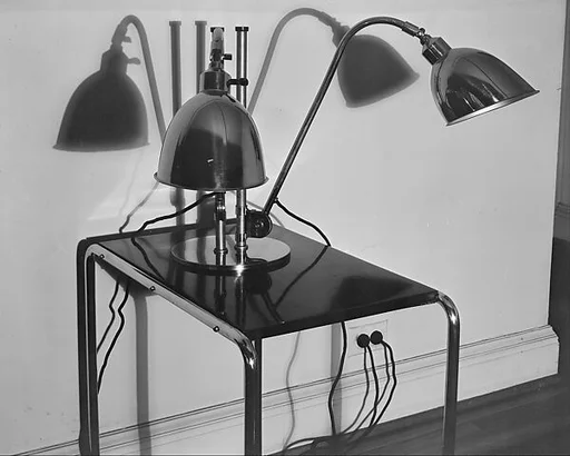 [Two Modernist Lamps on Tubular Table in Cary Ross' Apartment, New York City]