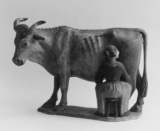 Girl milking a cow