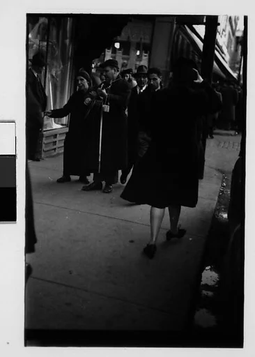 [Five 35mm Film Frames: Blind Street Musicians and Pedestrians on Sidewalk, Chicago, Illinois]