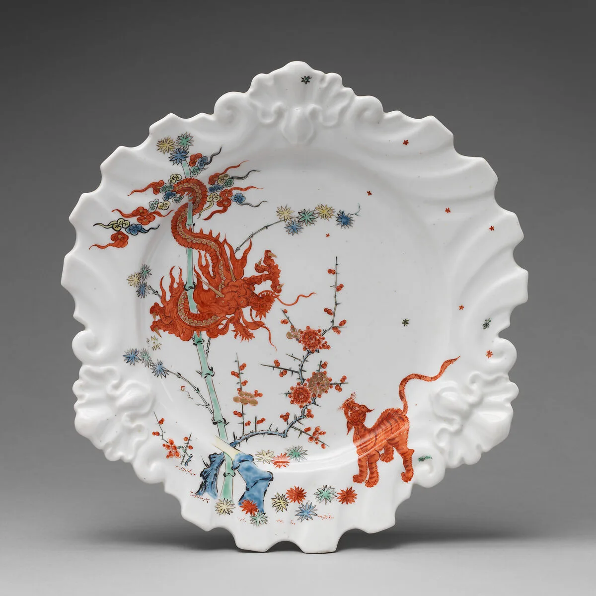 Plate decorated with Japanese Kakiemon-inspired scene with twisted dragon — Chelsea Porcelain Manufactory