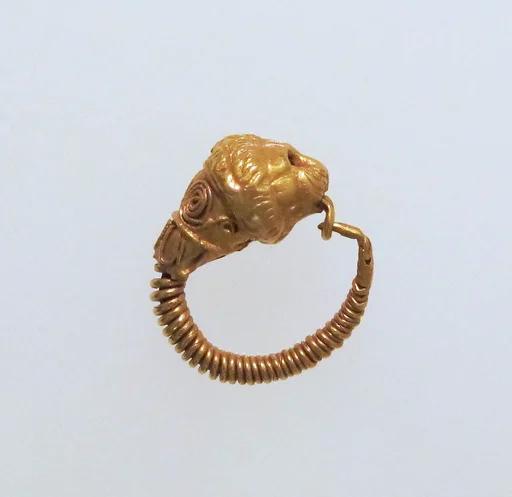 Gold earring with head of a lion