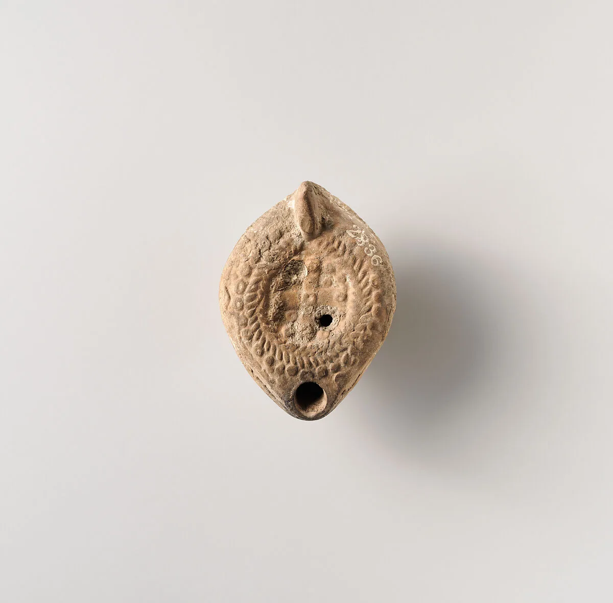 Terracotta oil lamp — Unknown