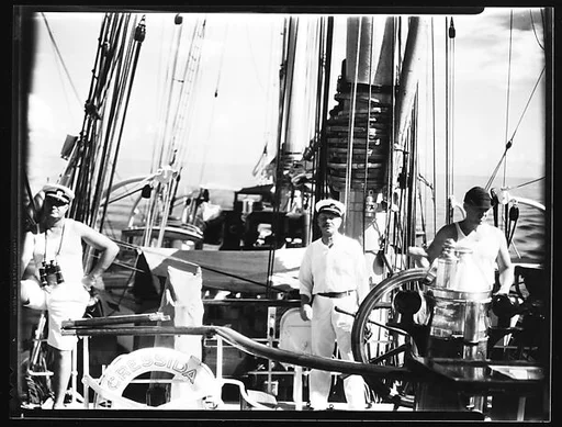 [South Seas: Crew Members at Helm of Cressida]