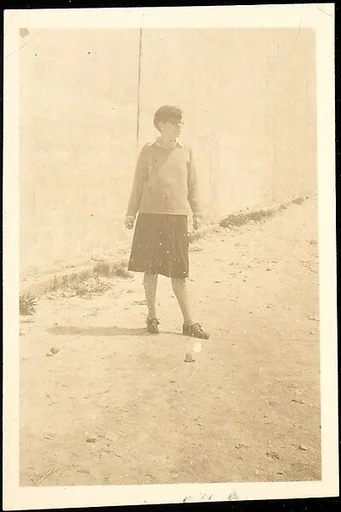 [Woman with Sweater and Horn-Rimmed Glasses]