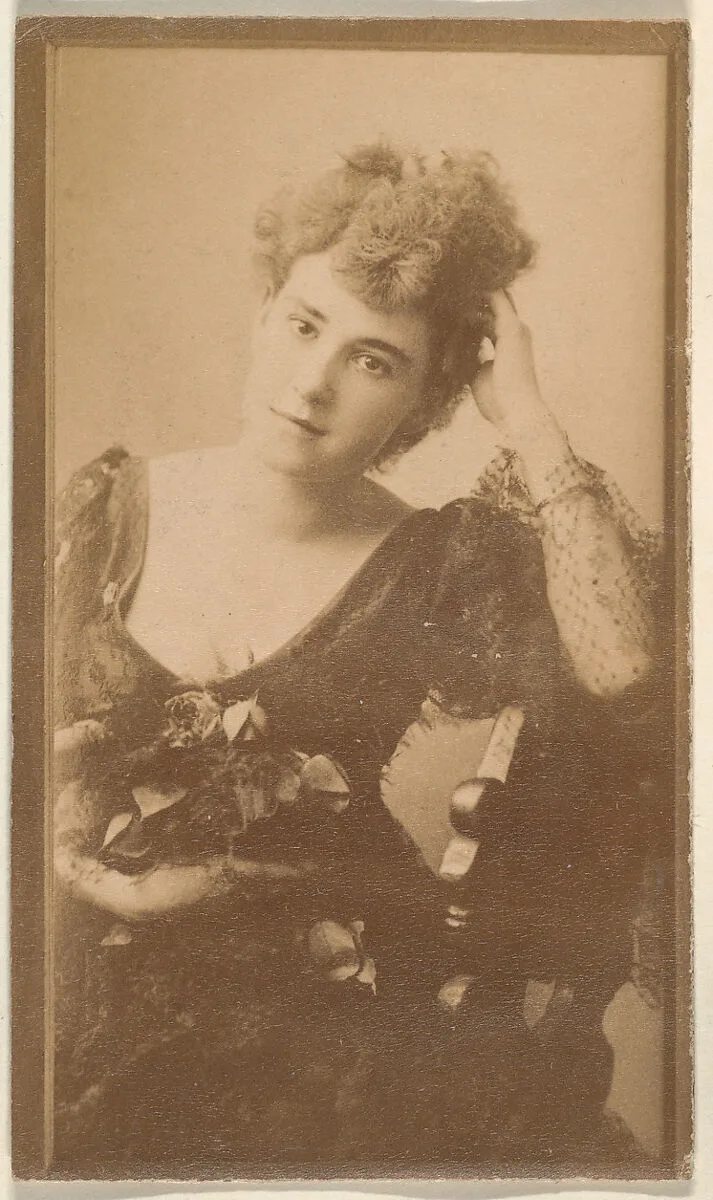 Seated actress leaning elbow on back of chair, from the Actresses series (N668) — Unknown