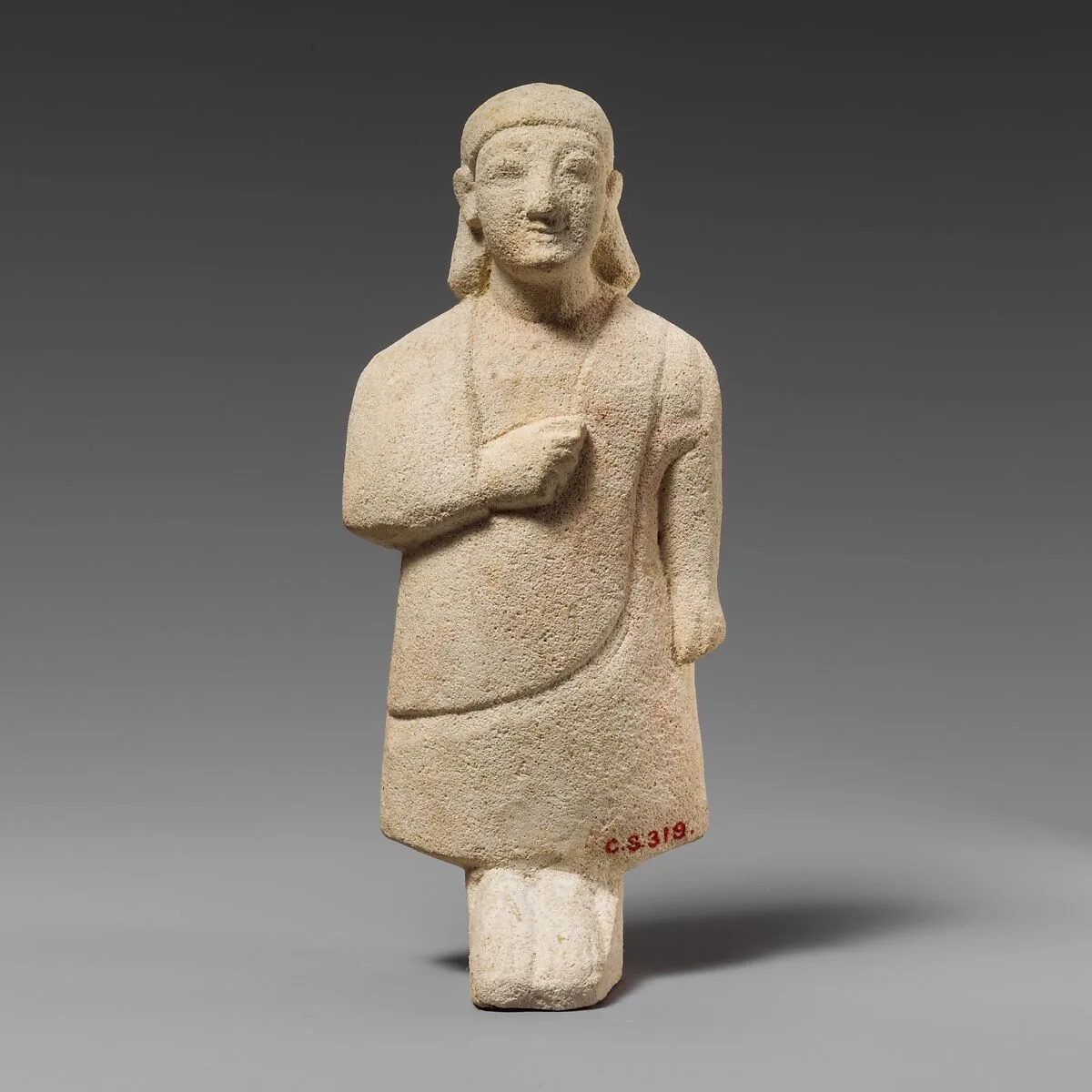 Limestone statuette of a male votary with a plain headdress — Unknown