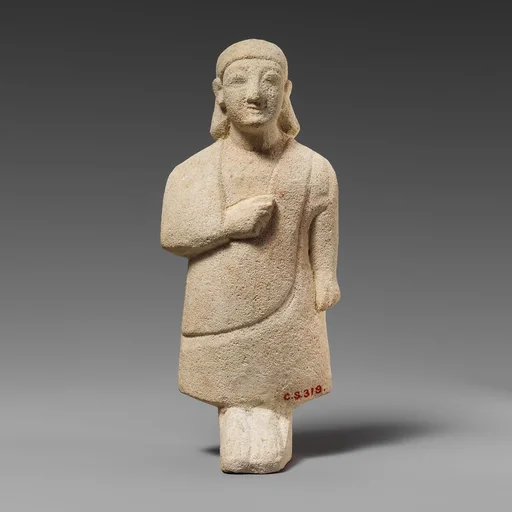 Limestone statuette of a male votary with a plain headdress