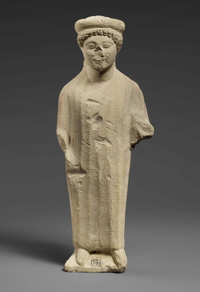 Limestone statuette of a boy with a flat headdress — Unknown