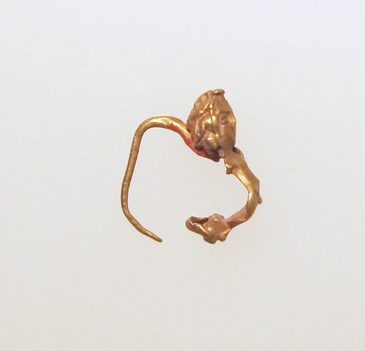 Gold earring with figure — Unknown
