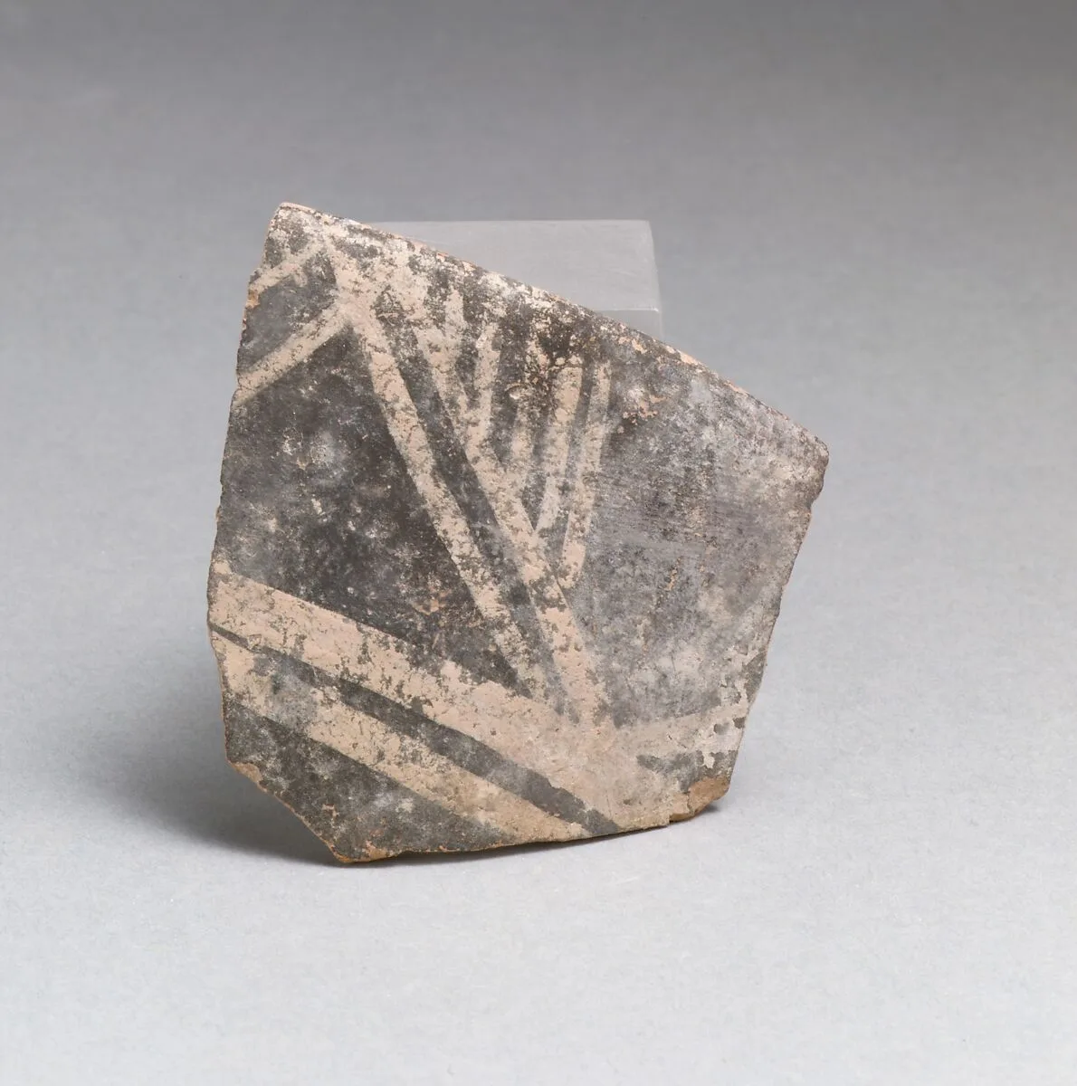 Terracotta rim from a cup with triangles and parallel vertical lines — Unknown