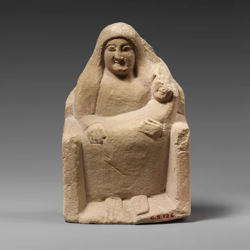 Seated limestone kourotrophos