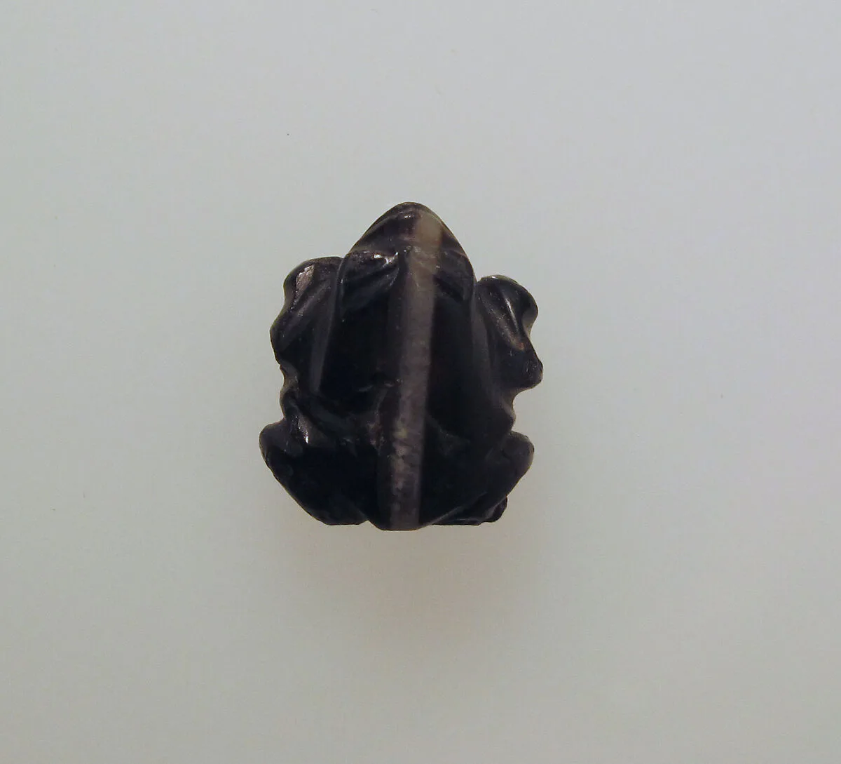Bead with frog in black agate — Unknown