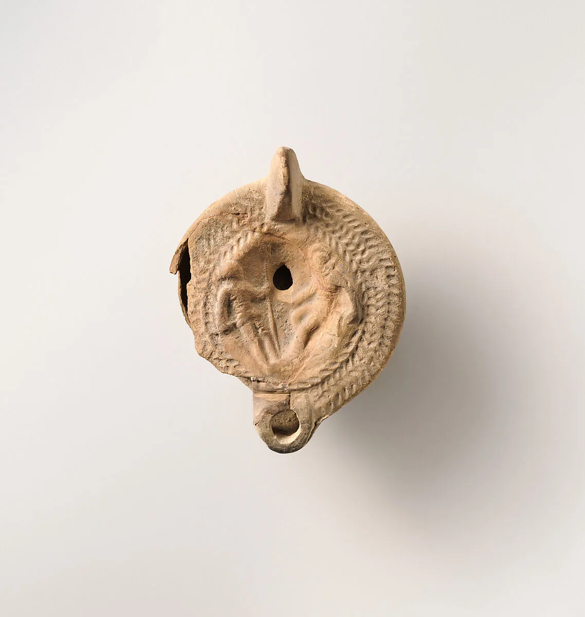 Terracotta oil lamp — Unknown