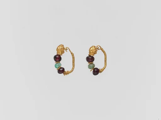Gold earring with woman's head and beryl and garnet beads