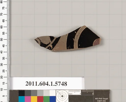 Terracotta fragment of a kylix: eye-cup (drinking cup)