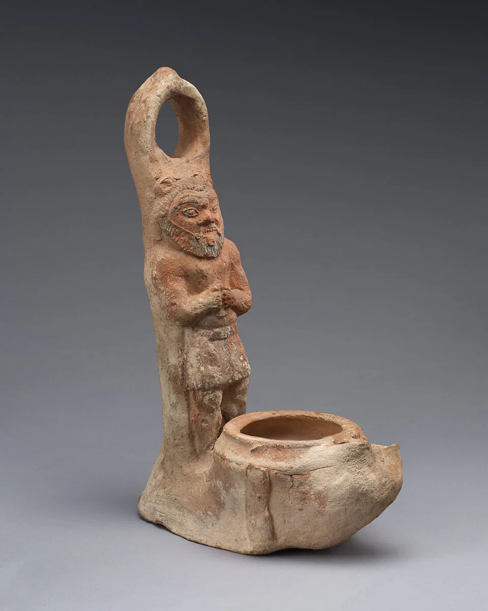 Terracotta lamp representing Bes — Unknown