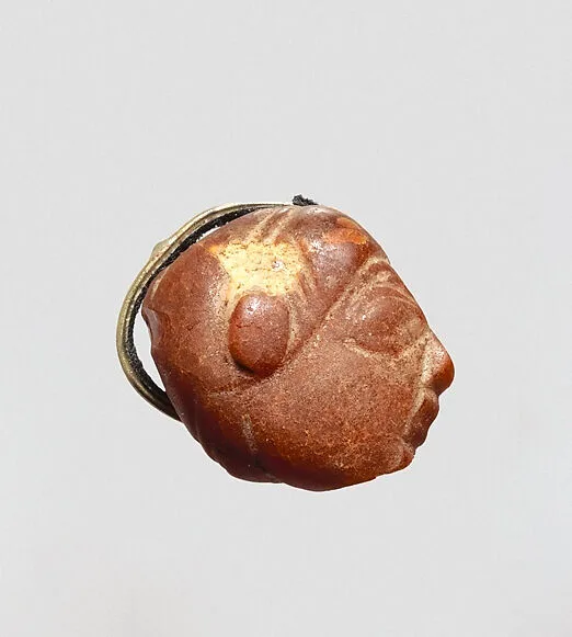 Pendant: winged female head — Unknown