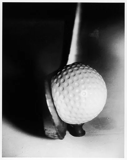 [Detail of Golf Club Hitting Ball]
