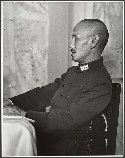 Chaing Kai-shek presides over his Supreme War Council just prior to the departure of the twenty-eight German advisors who had been instrumental in training his army. Hankow, July 4