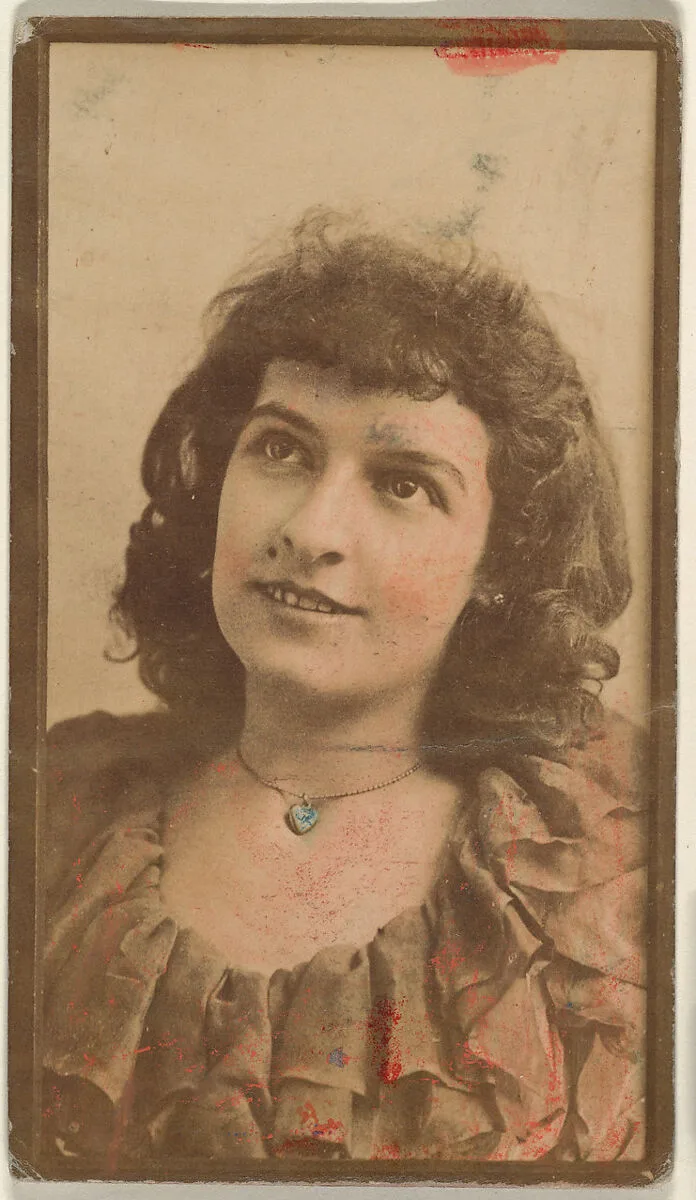 Actress wearing hand-colored blue necklace, from the Actresses series (N668) — Unknown