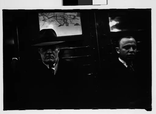 [Four 35mm Film Frames: Subway Passengers, New York City: Men in Suits]