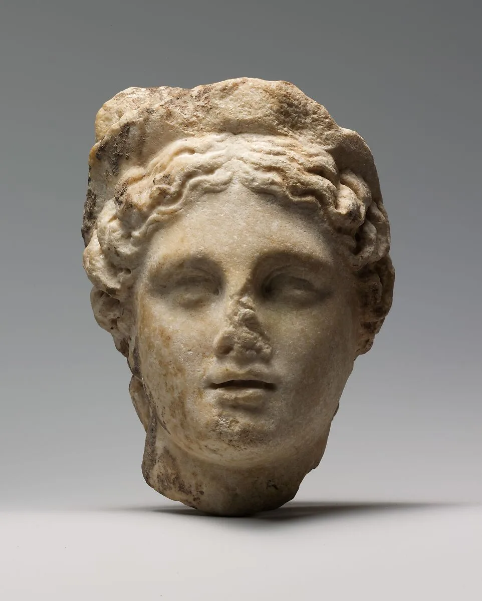 Marble head of a woman wearing a diadem — Unknown