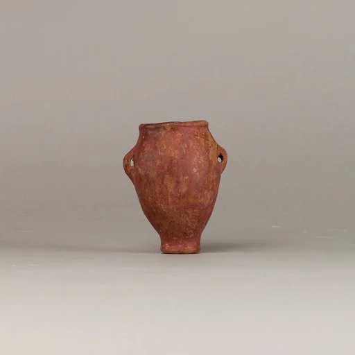 Polished red ware jar with lugs
