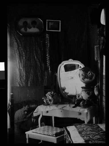 [Bedroom Interior with Dressing Stand, Pictures, and Tie Rack, Near Hobe Sound, Florida]