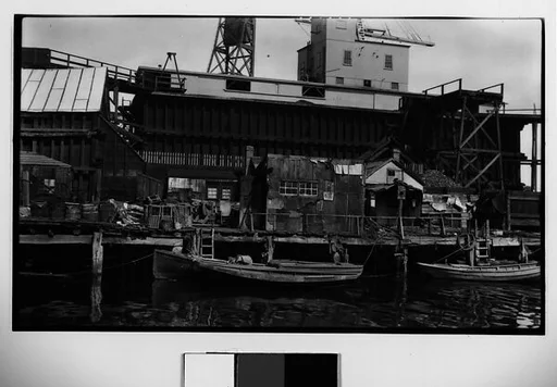 [Dock with Moored Boats and Warehouses]
