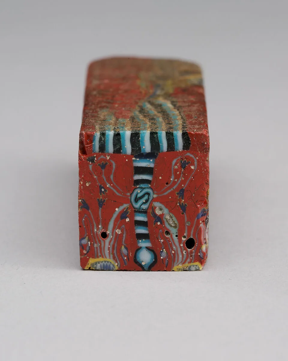Mosaic glass rod with a sema tawy sign — Unknown