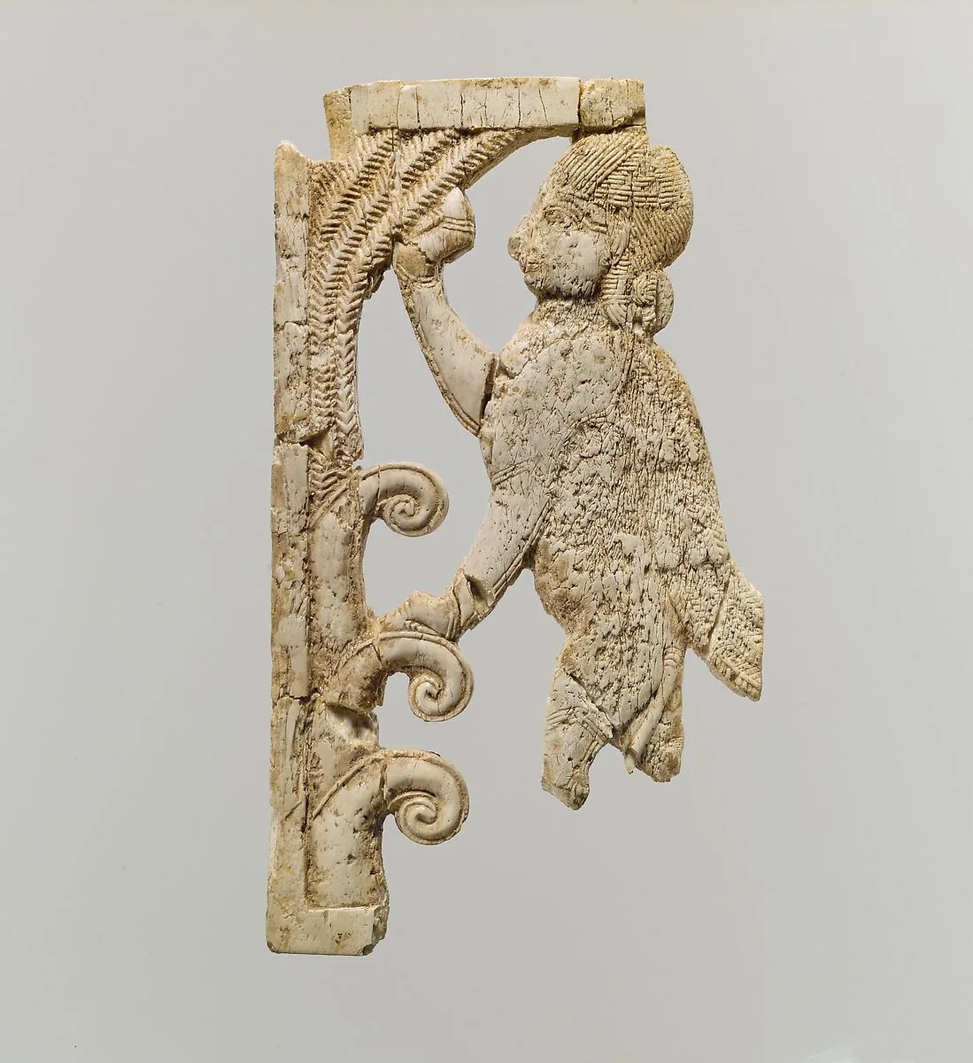 Openwork plaque with a sphinx at a tree — Unknown