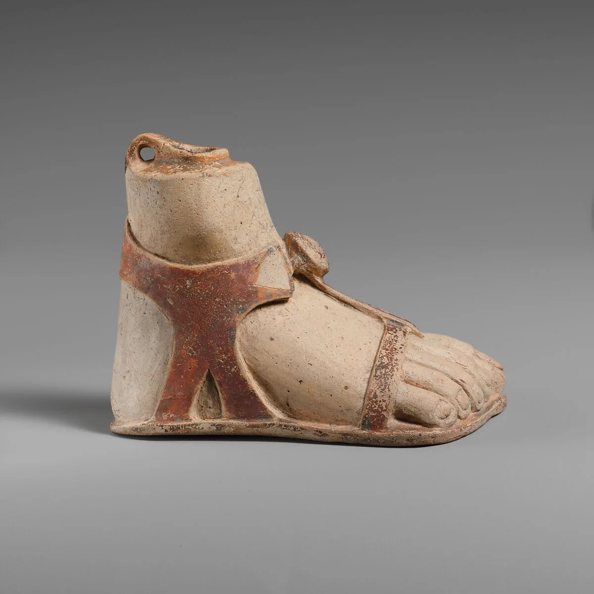 Terracotta aryballos (perfume vase) in the form of a sandaled right foot — Unknown