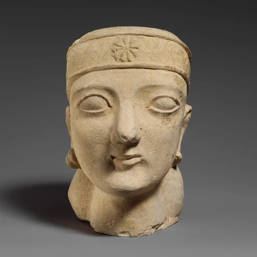 Limestone head of a beardless male with a diadem