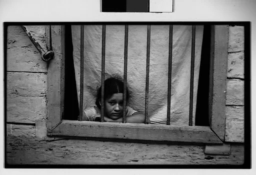 [Girl Behind Barred Window, Havana]