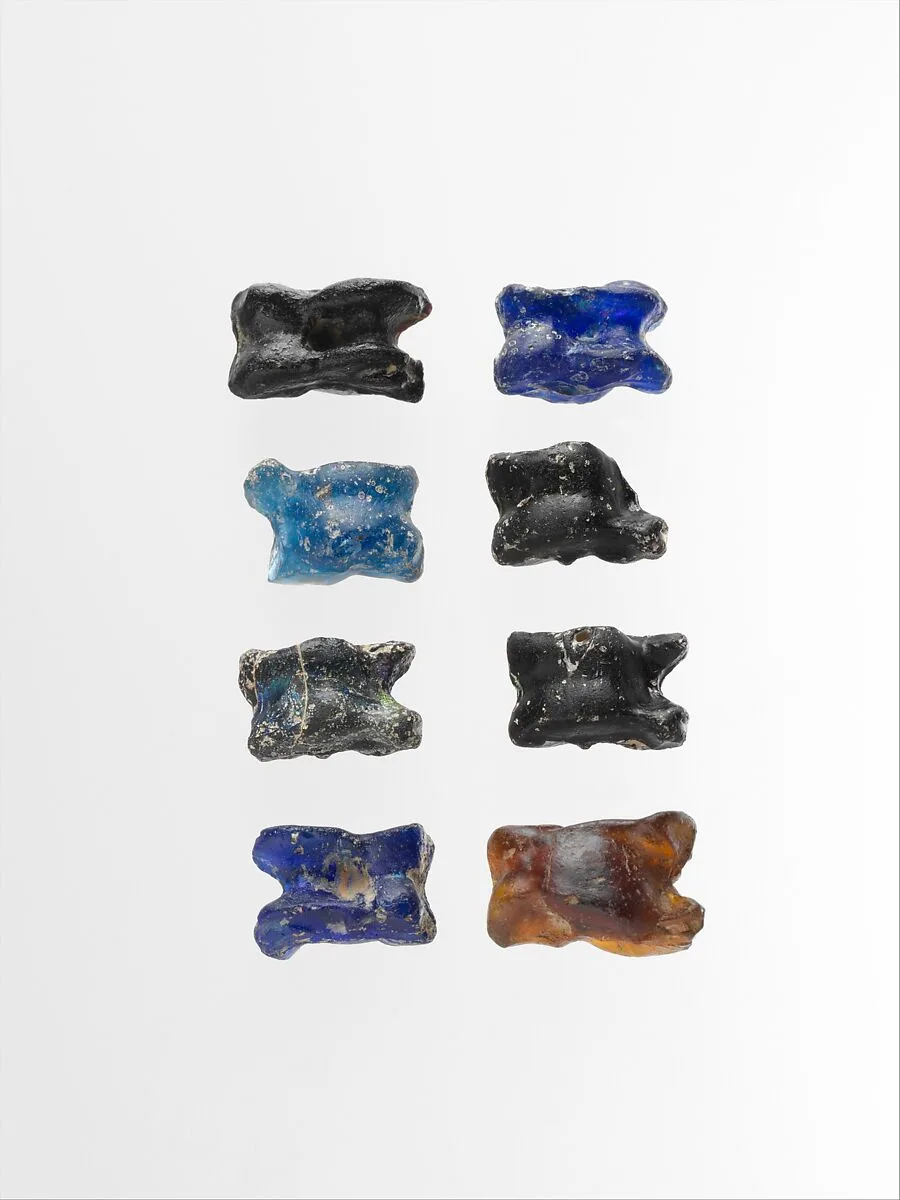 Group of eight glass astragali (knucklebones) — Unknown
