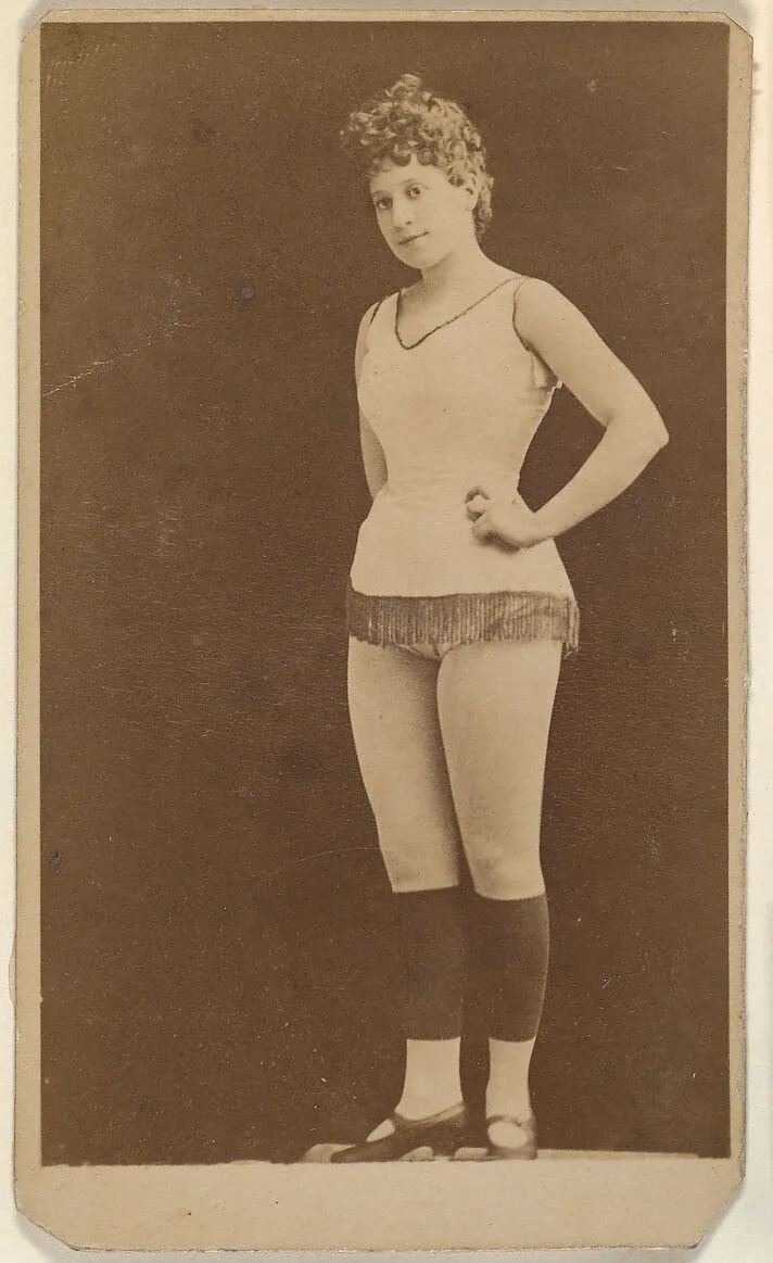 Actress standing with hands on hips, from the Actresses series (N668) — Unknown