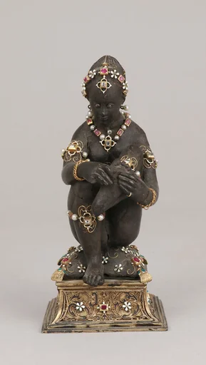 Woman pulling a thorn from her foot
