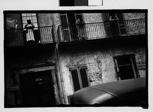 [People on Balconies of Shuttered Houses in French Quarter, New Orleans, Louisiana]