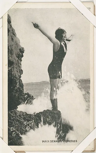 Bathing beauty on cliff with arms outstretched from Mack Sennett Comedies Arcade series (W423) — Unknown