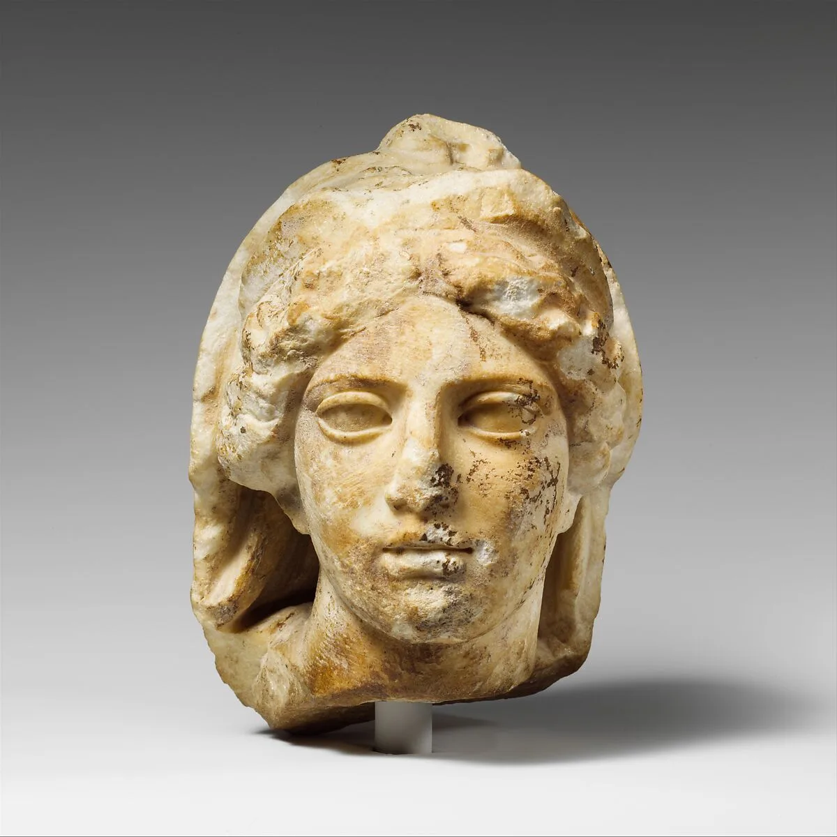 Marble head of a woman wearing diadem and veil — Unknown