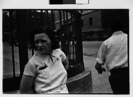 [Two 35mm Film Frames: Woman Standing on Street]