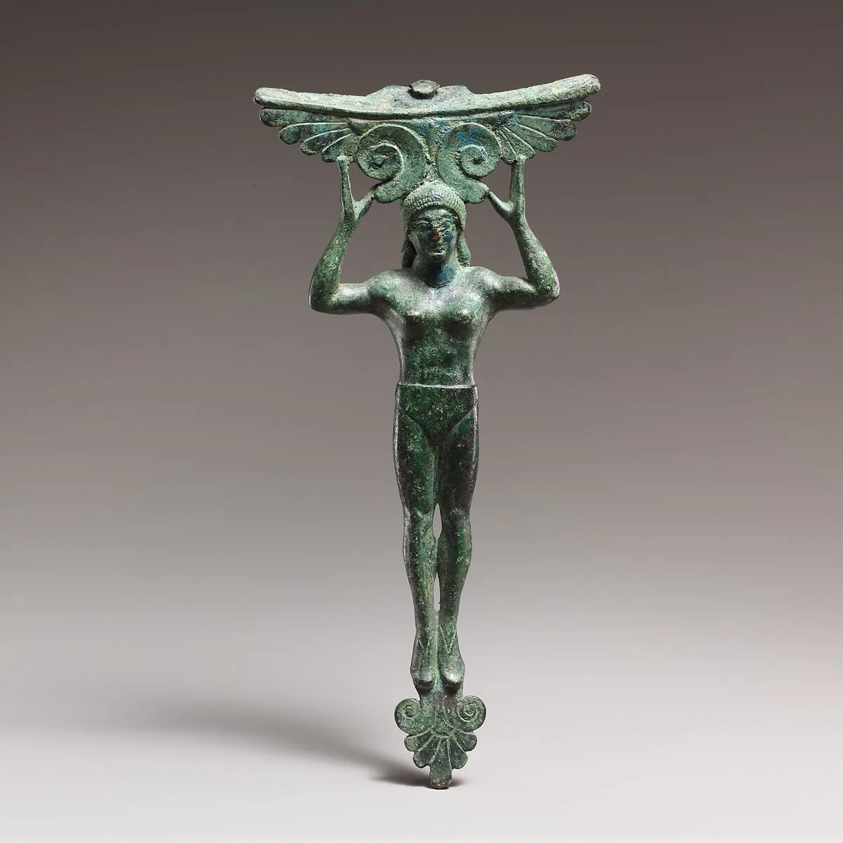 Bronze patera handle in the form of a young woman — Unknown
