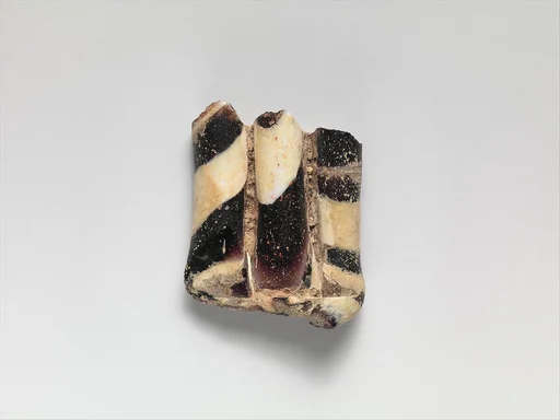 Glass mosaic handle fragment