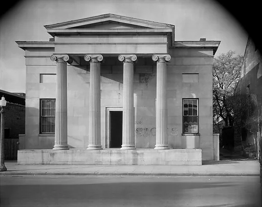 [Greek Revival Building with "SIGNS" Painted on Façade, Natchez, Mississippi]