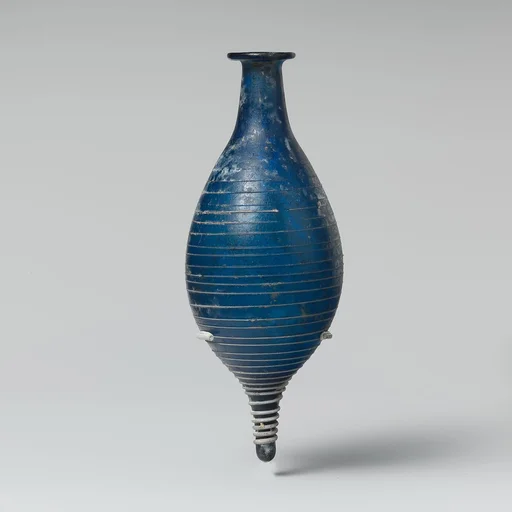Glass perfume bottle with opaque white trail
